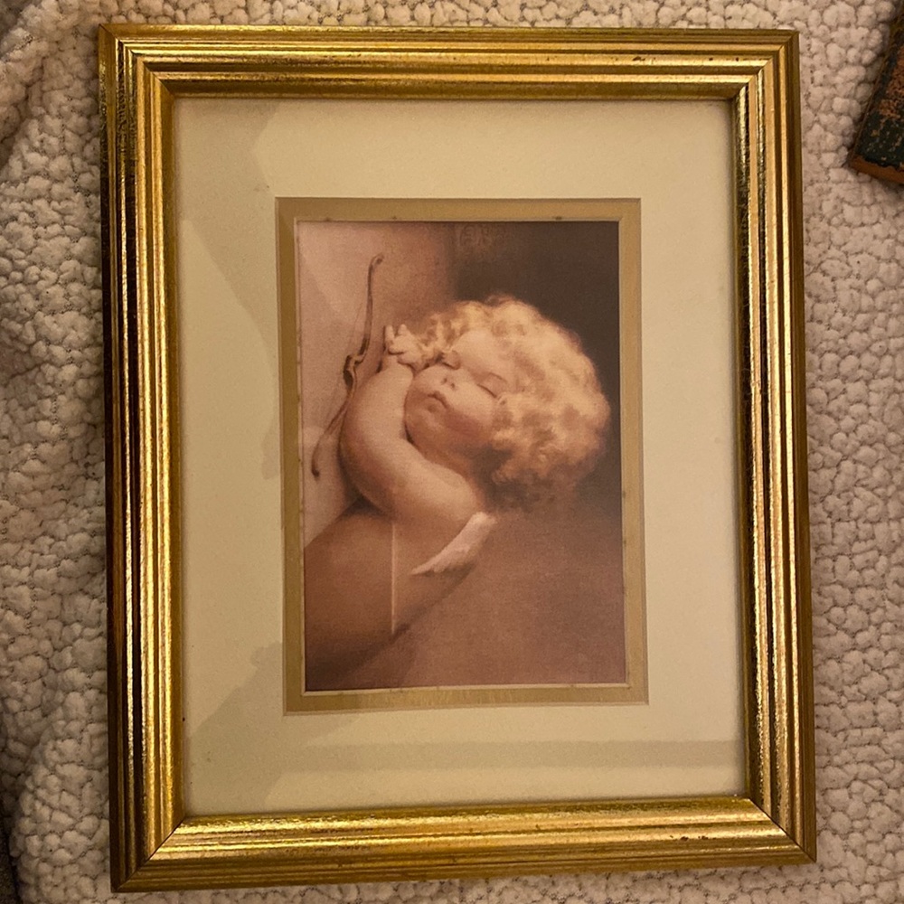 Angel/cherub print with double matting and gold frame. 11.5” X 9.5”.